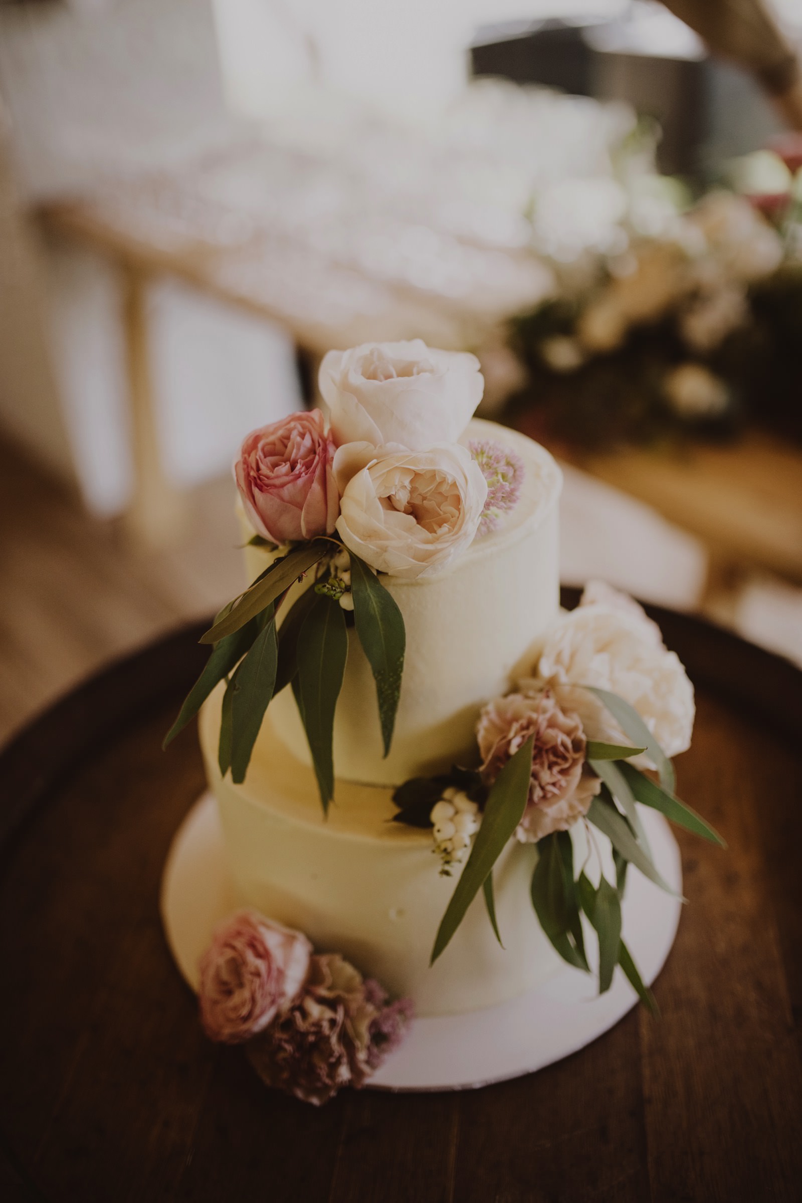 sarah and monte wedding cake with fresh flowers