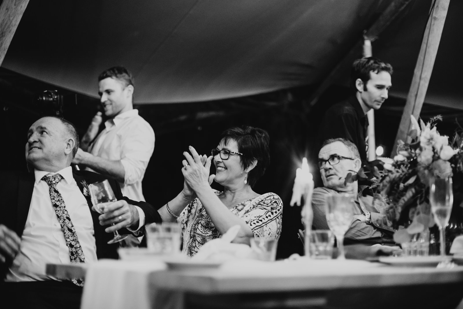 guests clapping at speeches inside the reception tipi