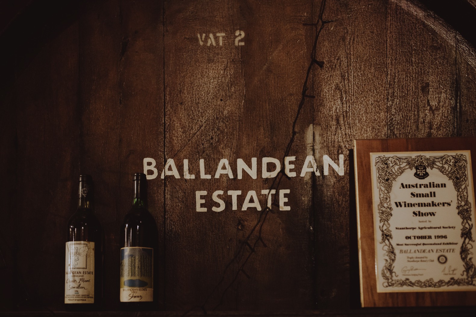 detail photo of wine bottle and barrel ballandean estate stanthorpe
