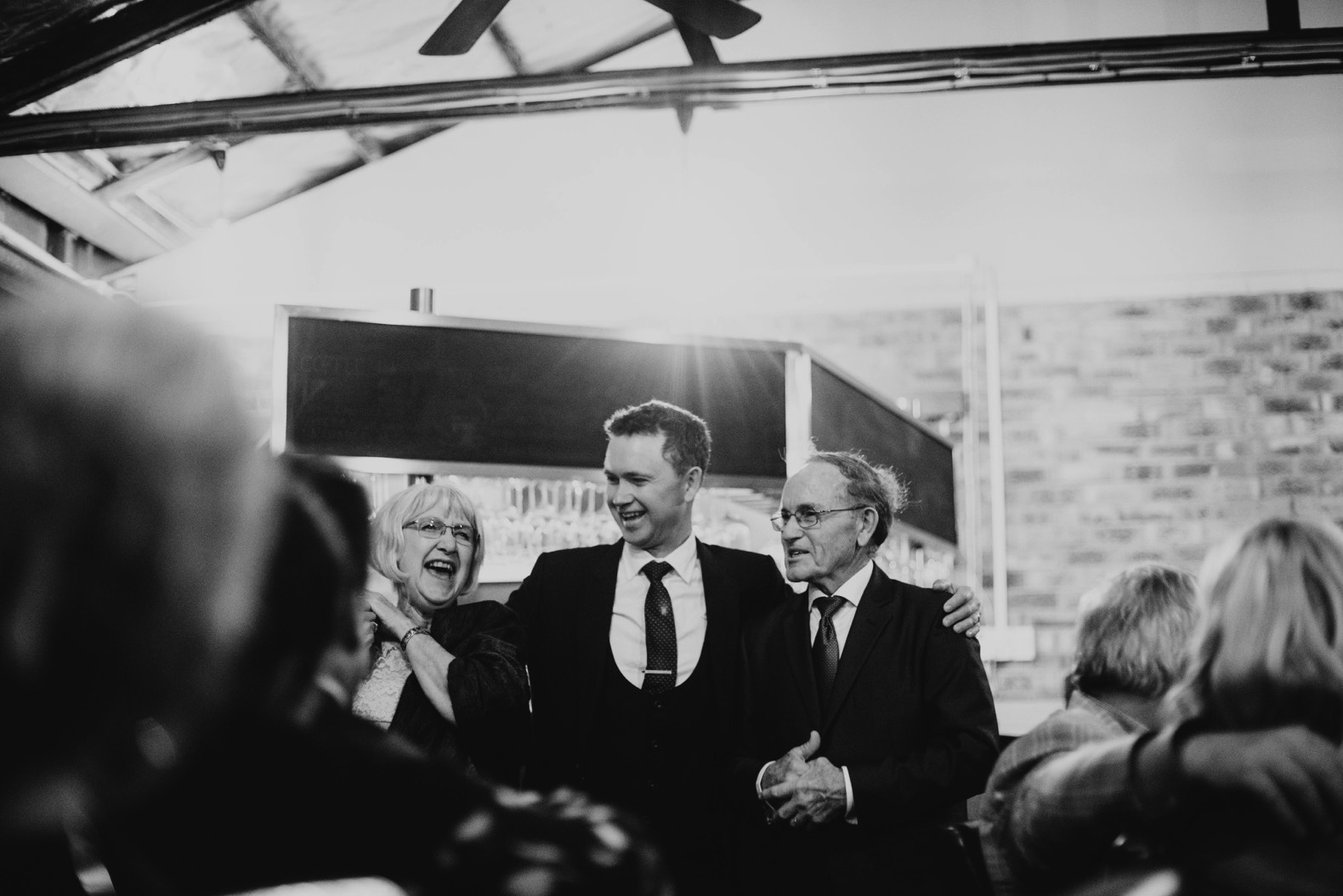 groom with his parents during speeches ballandean estate stanthorpe