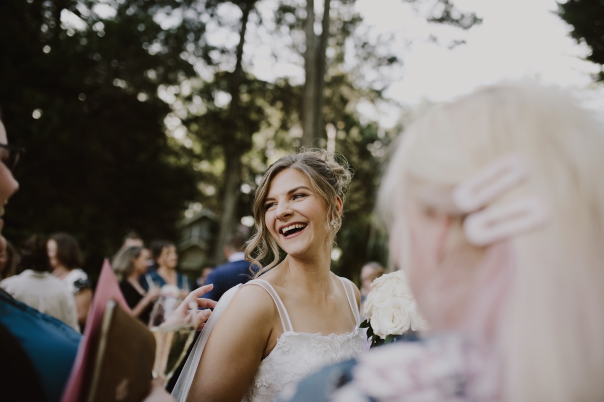bride laughing at wedding